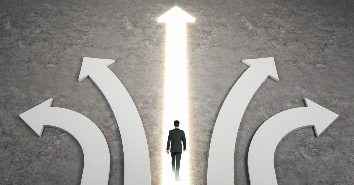 Image of several direction arrows with a man walking along a straight glowing arrow