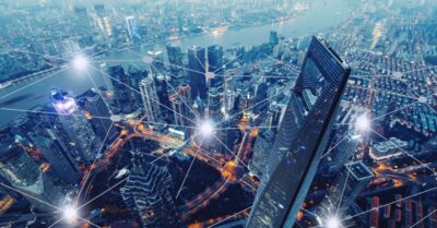 Photo of a cityscape with interconnected lines and sparks