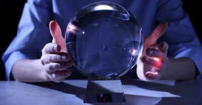 Photo of male hands around a crystal ball