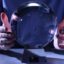 Photo of male hands around a crystal ball