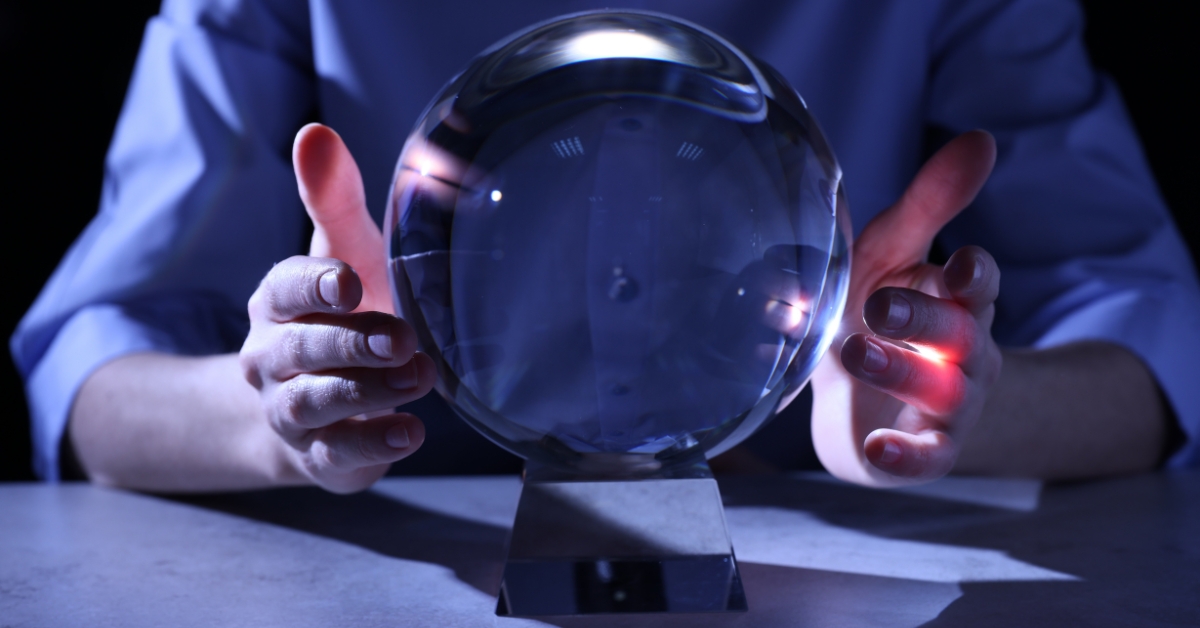 Photo of male hands around a crystal ball